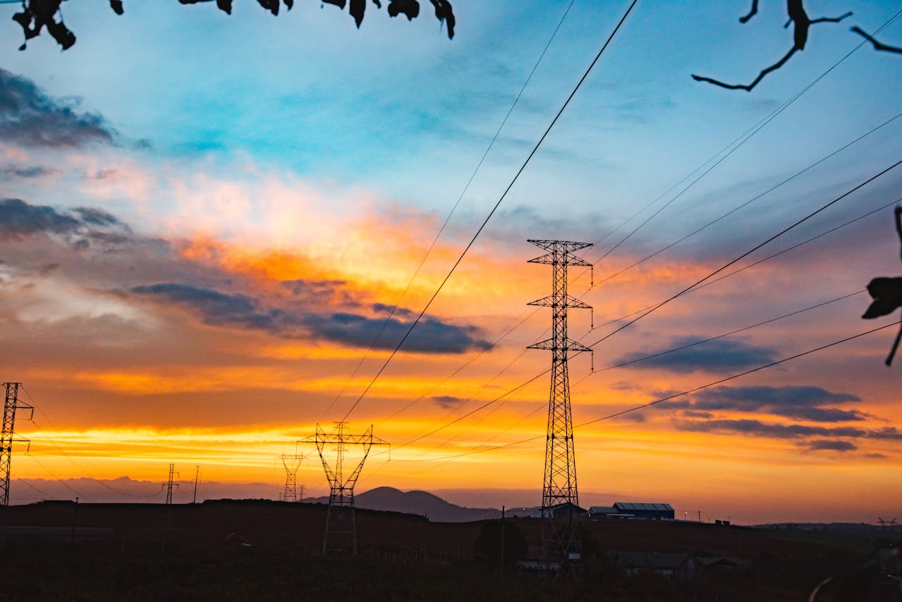 A photo of powerlines at sunset.